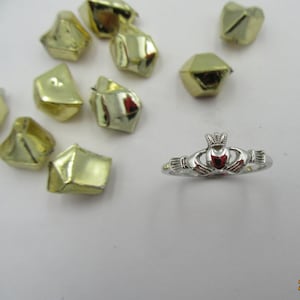 Very fine 14k white gold Claddagh ring .