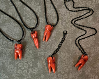 Red Molar necklace Color changing tooth