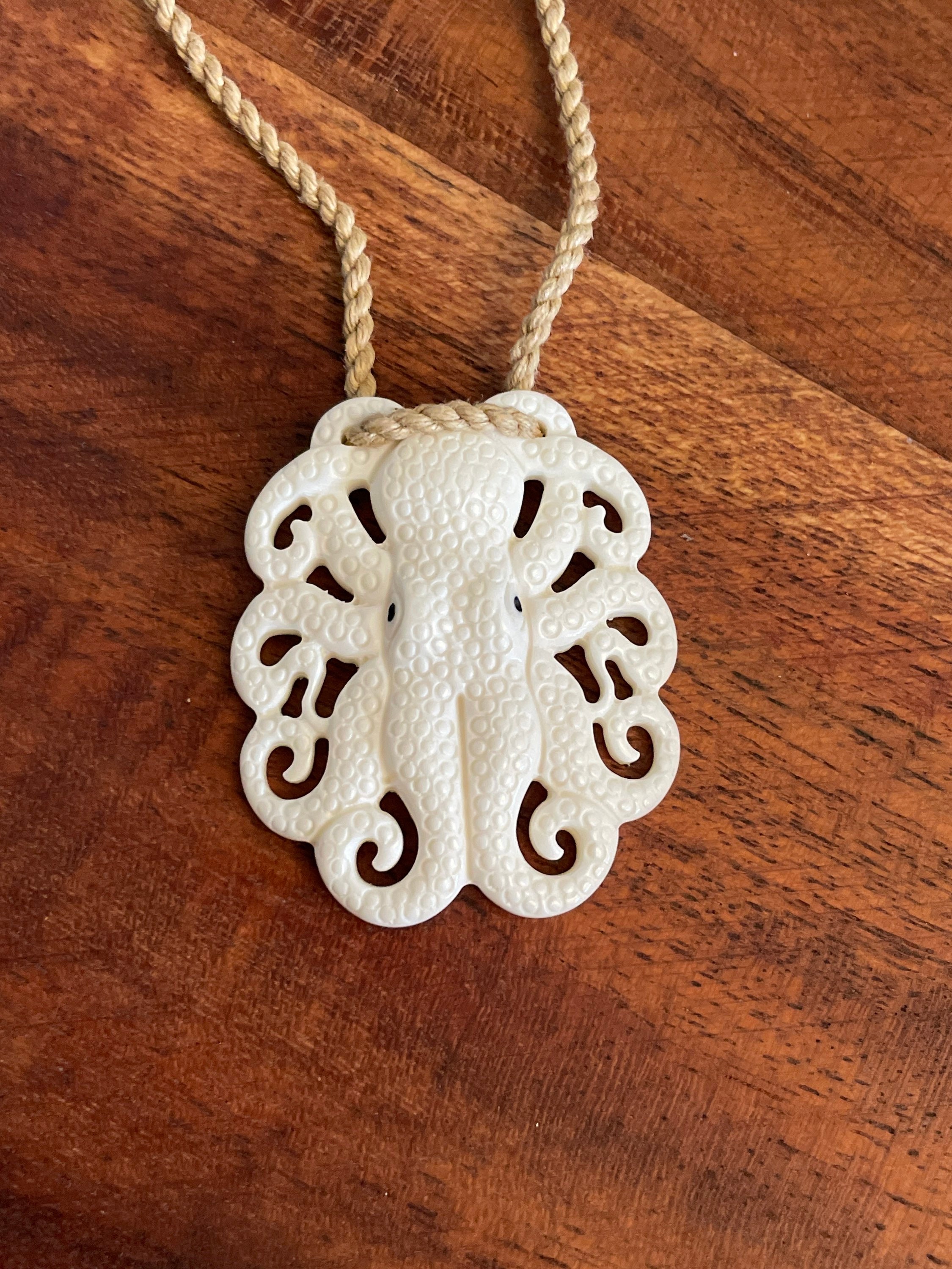 Absolutely Amazingly Detailed Hand Carved Octopus from Solid Buffalo Bone with several Korus, Traditional Pendant on Surfer Cord