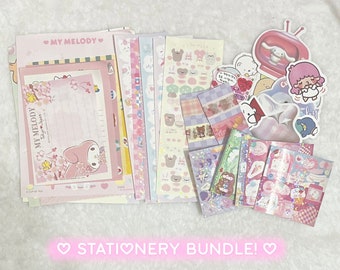 May include: A stationery bundle featuring My Melody, a popular Japanese character. The bundle includes stickers, washi tape, and letter paper in pink, blue, and white with a cute and whimsical design.