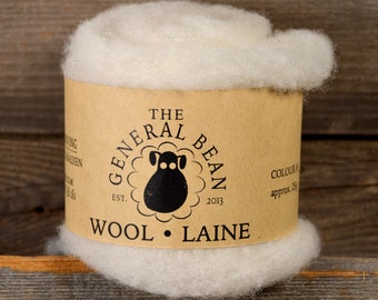 May include: A roll of white wool roving, labelled "The General Bean" with a sheep logo, "Est. 2013", and "Wool Laine".