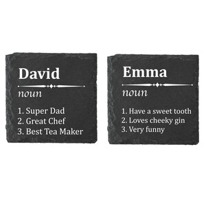May include: Two black slate coasters with white text. The first coaster says "David noun 1. Super Dad 2. Great Chef 3. Best Tea Maker". The second coaster says "Emma noun 1. Have a sweet tooth 2. Loves cheeky gin 3. Very funny".
