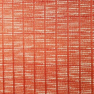 May include: Close-up of a textured fabric with a repeating pattern of vertical and horizontal lines. The fabric is primarily a warm, reddish-orange color, with white accents creating a grid-like design. The texture appears to be woven.