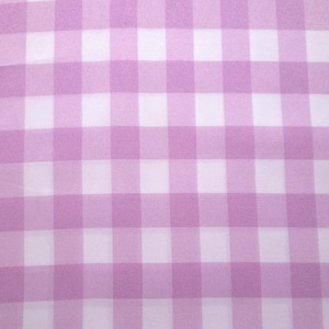 May include: A fabric featuring a repeating gingham pattern composed of alternating light purple and white squares. The textile displays a consistent grid design with a smooth, woven texture throughout the entire surface of the material.