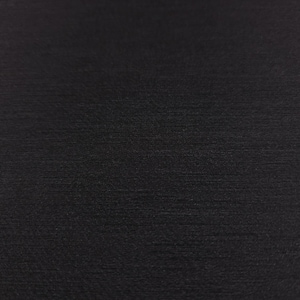 May include: A close-up shot of a black fabric with a subtle, horizontal textured pattern. The fabric appears to be smooth with a slight sheen, suggesting a high-quality material. The dark color provides a sense of depth and sophistication.