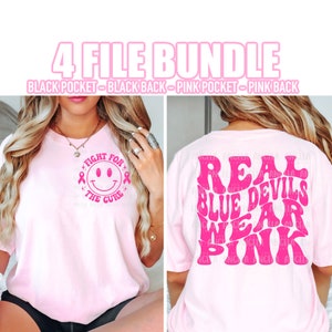 May include: Pink t-shirt with a pink smiley face with the text "Fight for the Cure" on the front and the text "Real Blue Devils Wear Pink" on the back.