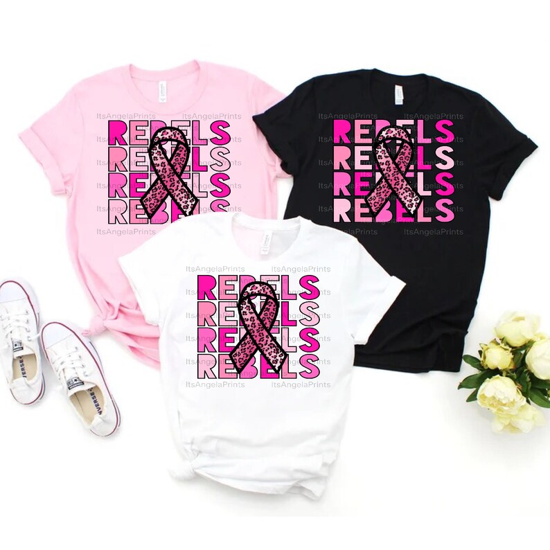May include: Three t-shirts in pink, black, and white with a pink ribbon with a leopard print design and the word "REBEL" repeated in pink shades.