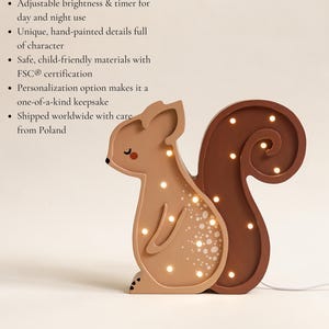 May include: A wooden squirrel-shaped night light with a warm, soothing LED. The light is brown and tan with hand-painted details. It has an adjustable brightness and timer for day and night use.