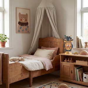 May include: A child's bedroom with a wooden bed, a framed bear illustration, and a robot-shaped lamp. The bed has pink and cream bedding. A striped canopy hangs above the bed. A wooden bookshelf holds toys and books. A patterned rug covers the floor.