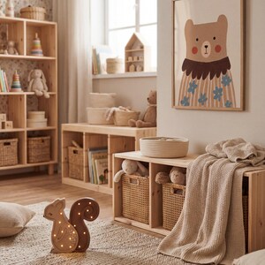 May include: A light-filled nursery with wooden furniture, including a bookshelf and storage unit. A framed bear illustration hangs on the wall. A decorative squirrel-shaped night light sits on the rug. Wicker baskets and soft toys add to the cozy atmosphere.
