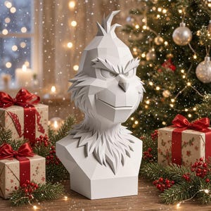 May include: A white, low-poly geometric bust of a character with a pointed tuft of hair, furrowed brows, and a smirk. The sculpture features sharp, angular facets and a smooth matte finish, presented as a decorative tabletop ornament.
