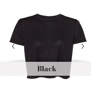 May include: A black cropped t-shirt with short sleeves.