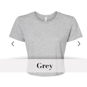 May include: A grey cropped t-shirt with short sleeves and a round neckline.