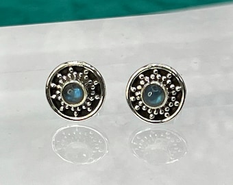 Sterling Silver Earrings with faux Opal center.