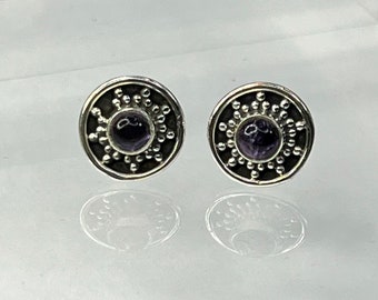 Sterling Silver Earrings with faux Amethyst center.