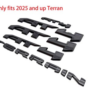 May include: Black car emblem set for the Terran model. The set includes multiple pieces, including the word "Terran" and other geometric shapes. The text "Only fits 2025 and up Terran" is visible in red.
