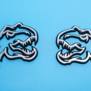 Chrome on Black Double Layer Dinosaur Fender Badges | Aggressive Raptor Design for F150, RAM 1500, and More | 2 Premium Badges