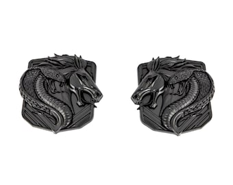 May include: Two black metal emblems featuring a horse and snake design. The horse is facing forward with its mouth open, and the snake is wrapped around its neck. The emblems are set against a textured background.