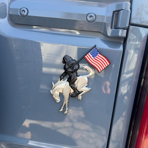 Black Sasquatch Riding Bronco with Flag – Fits 2021-2025 Ford Bronco (OEM emblem not included)
