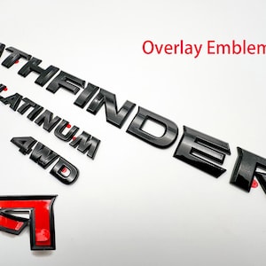 May include: Black overlay emblems for a Pathfinder Platinum 4WD vehicle. The emblems include the words "Pathfinder", "Platinum", and "4WD".