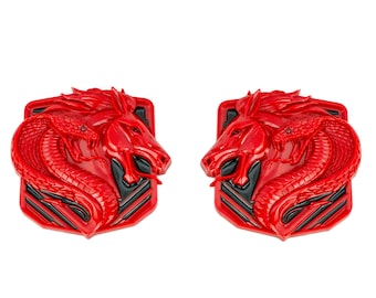 May include: Two red, three-dimensional, decorative emblems featuring a horse and snake intertwined. The emblems have a black and white striped background.
