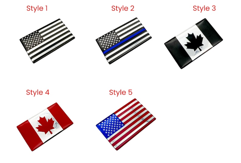 May include: Rectangular flag-themed accessories. Style 1 features a black and white American flag. Style 2 has a blue stripe. Style 3 displays a Canadian flag. Style 4 shows a red and white Canadian flag. Style 5 is a red, white, and blue American flag.