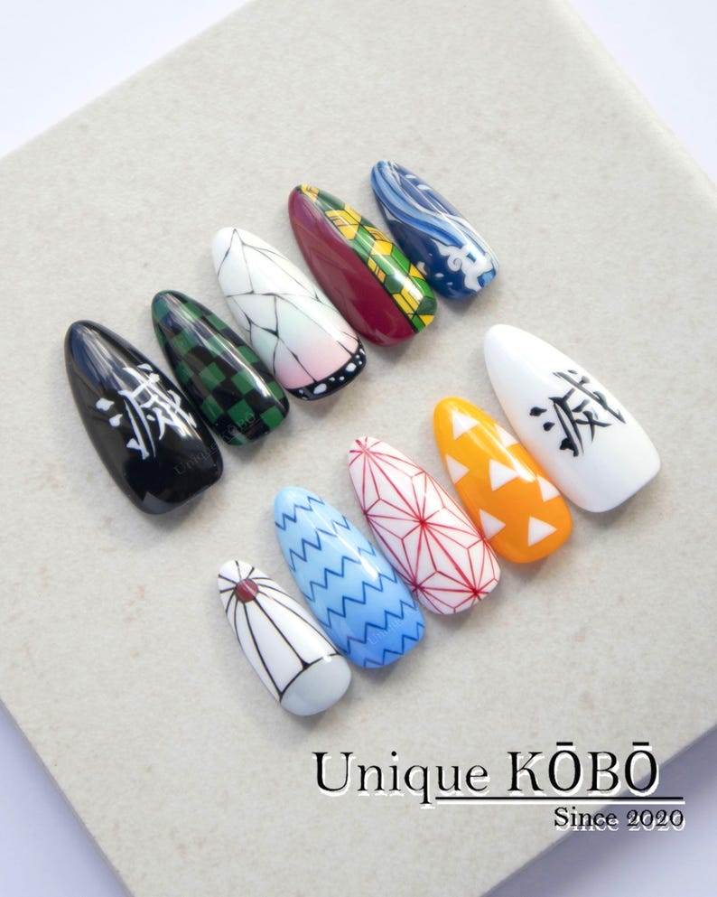 Hand-painted anime costume press-on nails with flat nail art for easy wear, featuring subtle character motifs and soft gel colours. Smooth, reusable, and crafted for cosplay fans and collectors.