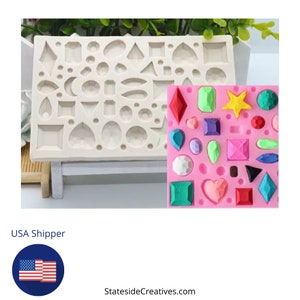 May include: A silicone mold with two sections. The first section has 24 different shapes, including hearts, stars, circles, and diamonds. The second section shows the shapes filled with colorful resin. The mold is pink and white.