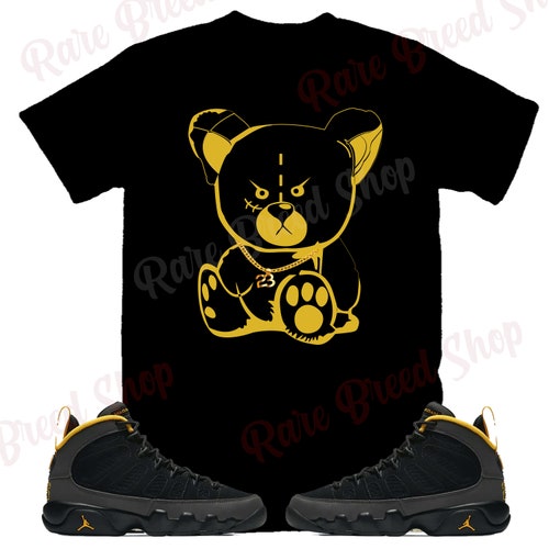 dark charcoal university gold shirt