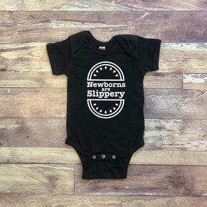 Newborns Are Slippery - The Office Baby Gift - Black Infant Bodysuit - NB, 6M, 12M, 18M, 24M - Unisex Gender Neutral Baby, Dunder Mifflin