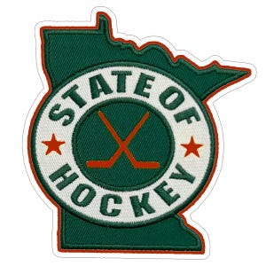 May include: A green outline of the state of Minnesota with a white circle in the center. The circle has the text "State of Hockey" with two crossed hockey sticks in the center. There are two red stars on the circle.