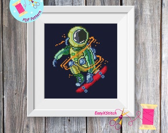 Astronaut with skateboard cross stitch pattern Space cross stitch pattern Planets cross stitch
