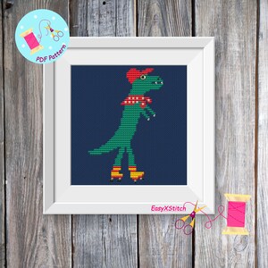 May include: Cross stitch pattern of a green dinosaur wearing a red hat and a red and white scarf, roller skating on a blue background. The pattern is framed in white and the text "EasyXStitch" is visible at the bottom.