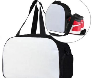 May include: A black and white travel duffel bag with a zippered pocket and a white blank canvas area for customization. The bag is shown with a pair of red sneakers inside.