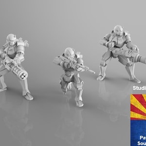 May include: Three white 3D printed miniature figures of soldiers, each holding a different weapon. The figures are posed in action stances. The figures are printed by Patriot Printing in Southern Arizona.