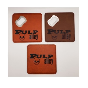 May include: Three brown leather coasters with a bottle opener and the text "PULP alley" and a skull graphic.