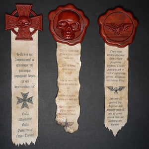May include: Three parchment scrolls with wax seals and Latin text. The seals feature a skull, a cross, and an eagle. The text on the scrolls is in a gothic font.