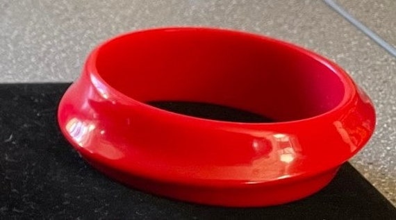 Red plastic bangle bracelet - image 1