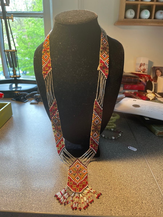 Woven necklace of tiny beads