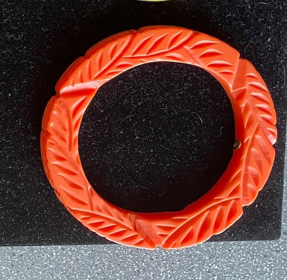 Orange plastic bangle, carved - image 1