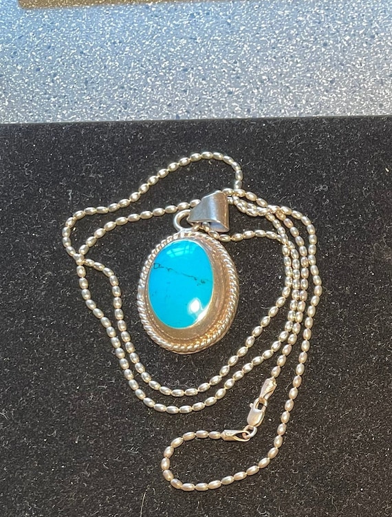 Sterling chain with a heavy sterling and turquoise