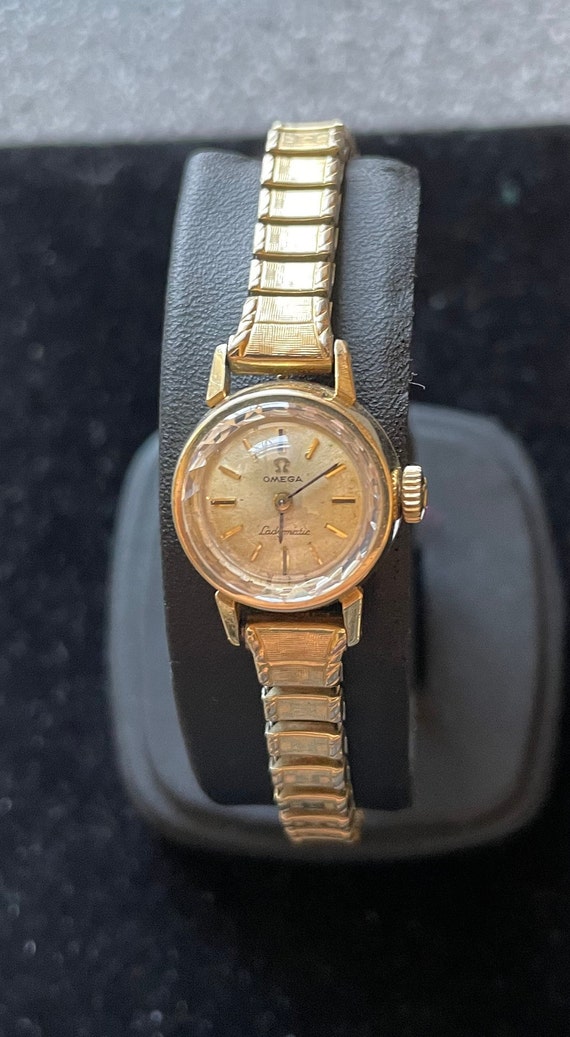 14K gold Ladies Omega watch with 14K band, ca. 196