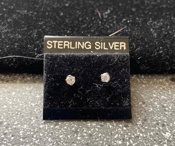 Two tiny diamond earrings - image 1