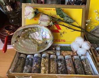 Magical witch's herbs, cigars, boxes, jars, herbs, flowers, spells, protections, love, silk, roses, love spells, crystals, incense, books