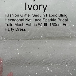 May include: Ivory tulle fabric with hexagonal glitter sequins. The fabric is 150cm wide and is described as "Fashion Glitter Sequin Fabric Bling Hexagonal Net Lace Sparkle Bridal Tulle Mesh Fabric Width 150cm For Party Dress".