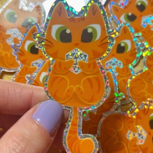 Cute unique glitter orange cat holding D20 sticker|cat art sticker| vinyl sticker| catperson | Catlady | nerd cat holding dice