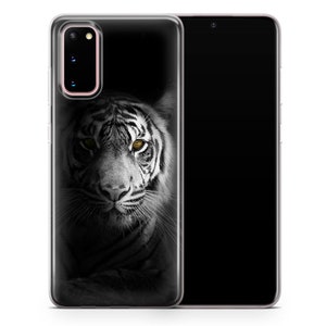 May include: A clear phone case with a black and white image of a white tiger with yellow eyes. The tiger is looking directly at the camera.