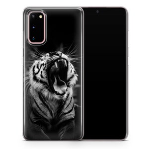 May include: Black and white phone case featuring a close-up of a tiger with its mouth open, showing its teeth and tongue.