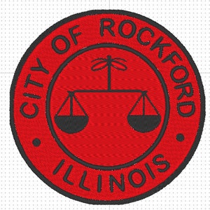 May include: Embroidered red circular patch with the text "CITY OF ROCKFORD ILLINOIS" in a black font. The center features a black scale design. A decorative item.