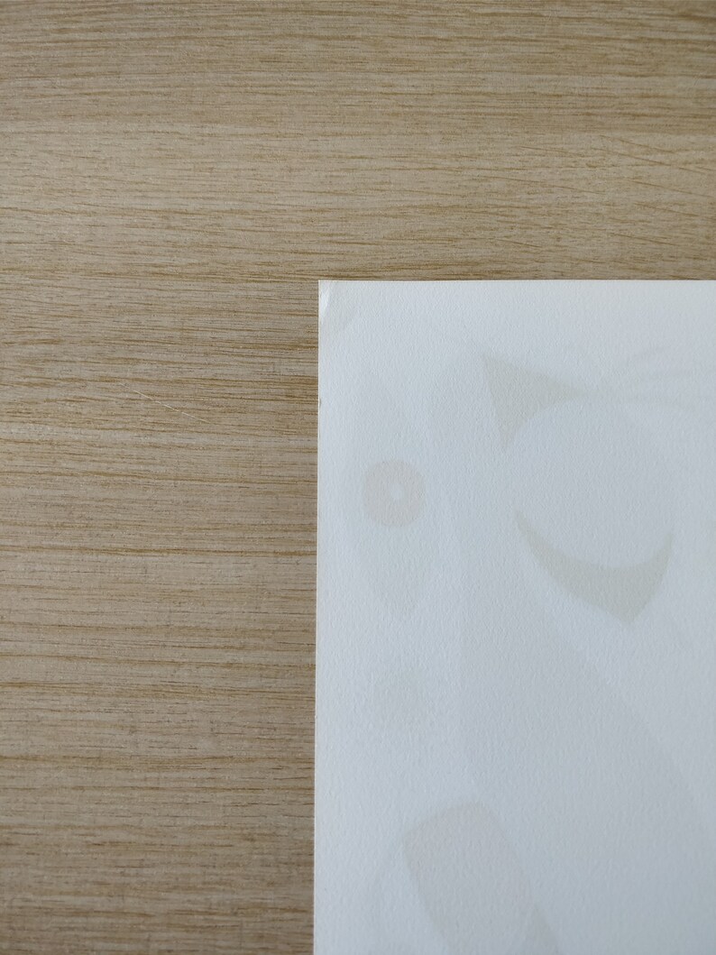 May include: A close-up of a white surface with faint, light brown stains. The surface is textured and has a subtle sheen.